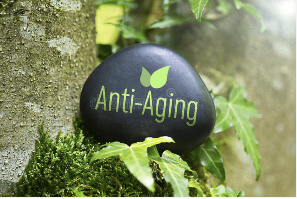 A rock with the words " anti-aging " on it.