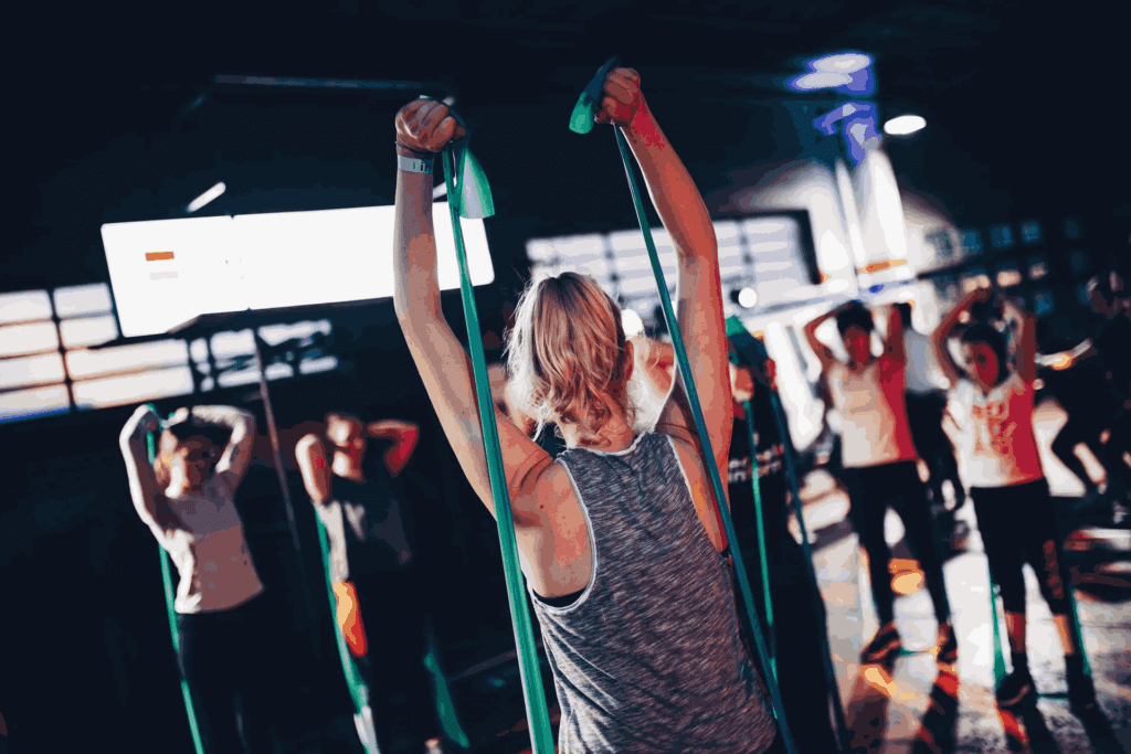 A group of people in the gym doing exercises.