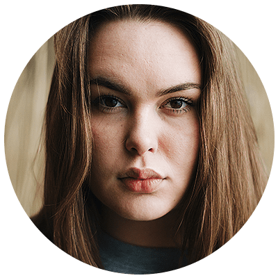 A young woman with brown hair in a circle.